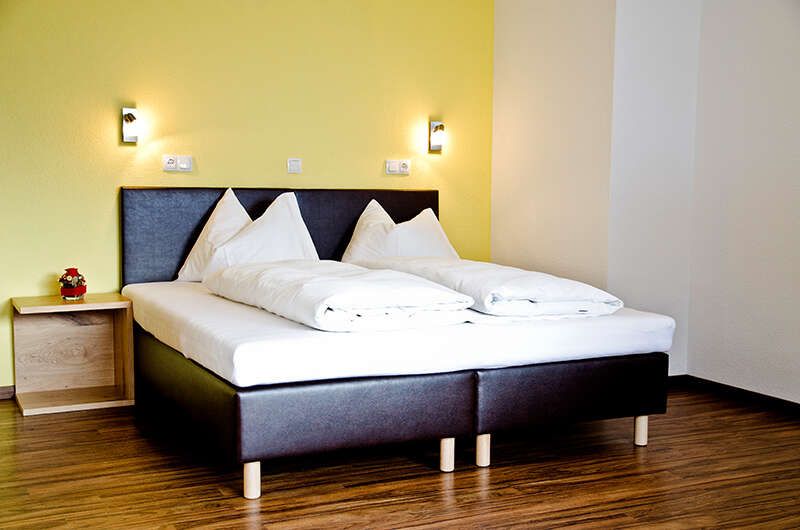 Doppelbett im Appartement Top 4 im Chalet Barbara